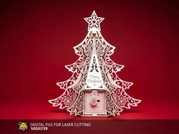 Laser cut plywood Christmas tree gift box with lace fins, star topper and Merry Christmas roof on a red background