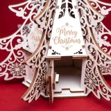 Open front door of the Christmas tree box revealing the hexagonal inner compartment for sweets or a small gift
