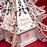 Close-up of the engraved Merry Christmas roof panel and snowflake engraving on the box wall