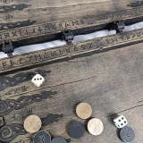Checker storage pocket along the front of the backgammon half
