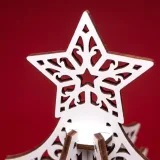 Close-up of the carved star topper on the laser cut Christmas tree box, showing the fins fitting into the top cap