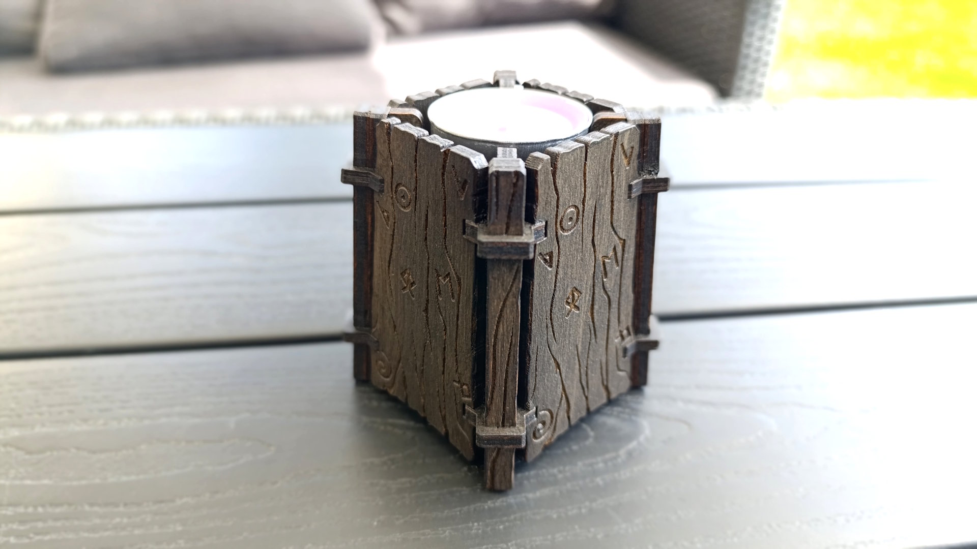 Wood-patterned candle holder with rune engraving